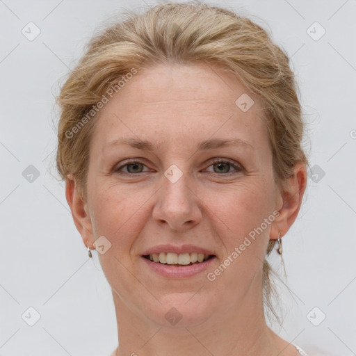 Joyful white adult female with short  brown hair and grey eyes