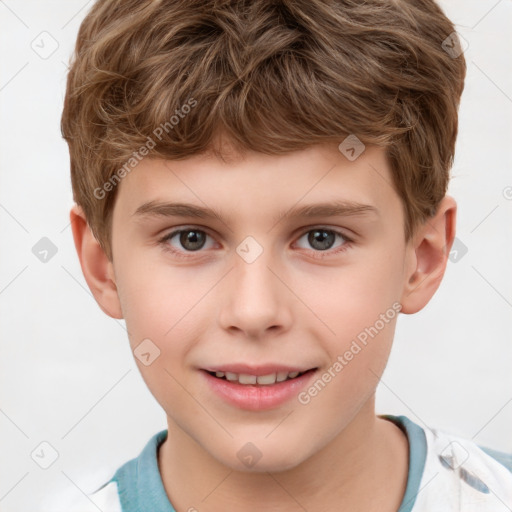 Joyful white child male with short  brown hair and brown eyes