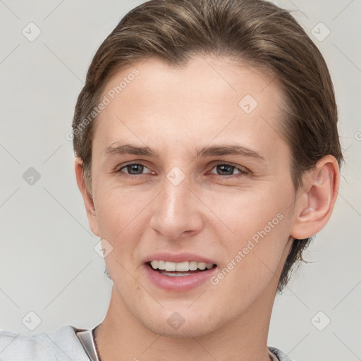 Joyful white young-adult female with short  brown hair and grey eyes