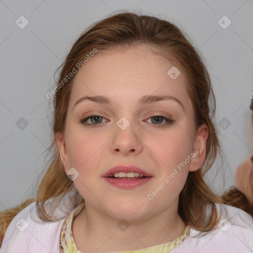 Joyful white child female with medium  brown hair and blue eyes