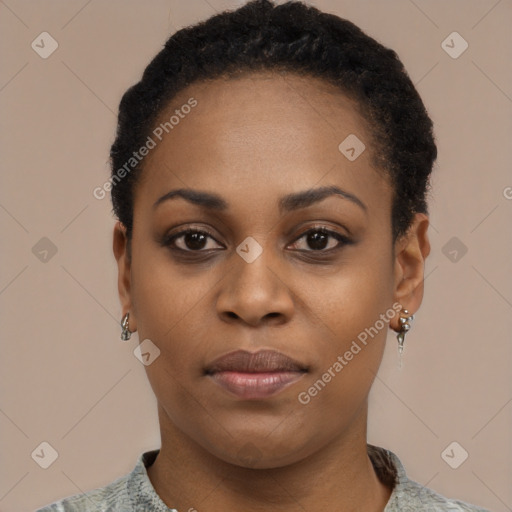 Joyful black young-adult female with short  black hair and brown eyes