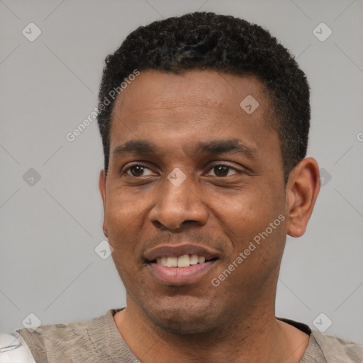 Joyful latino young-adult male with short  black hair and brown eyes