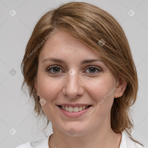 Joyful white young-adult female with medium  brown hair and grey eyes