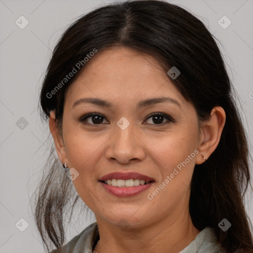 Joyful white adult female with medium  brown hair and brown eyes