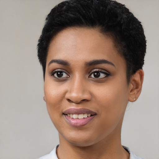 Joyful latino young-adult female with short  black hair and brown eyes