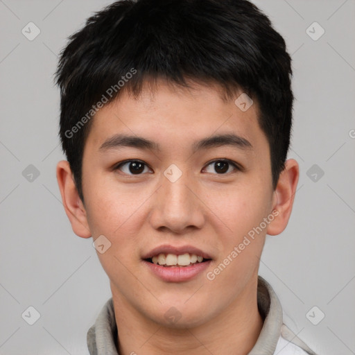 Joyful asian young-adult male with short  brown hair and brown eyes