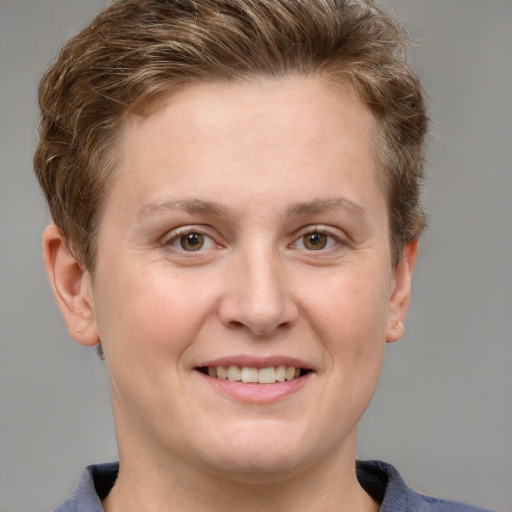 Joyful white adult female with short  brown hair and grey eyes