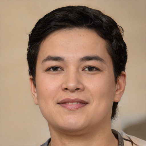 Joyful white young-adult male with short  black hair and brown eyes