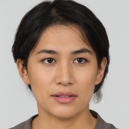 Neutral latino young-adult female with medium  black hair and brown eyes