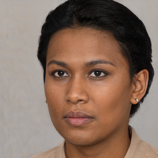 Neutral black young-adult female with short  black hair and brown eyes