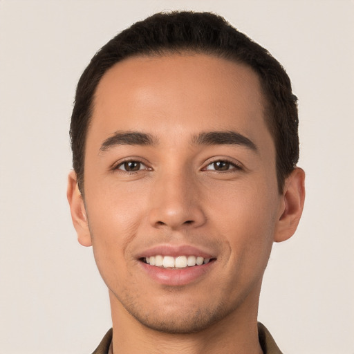 Joyful white young-adult male with short  black hair and brown eyes