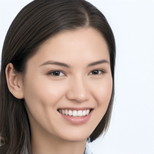 Joyful asian young-adult female with long  brown hair and brown eyes