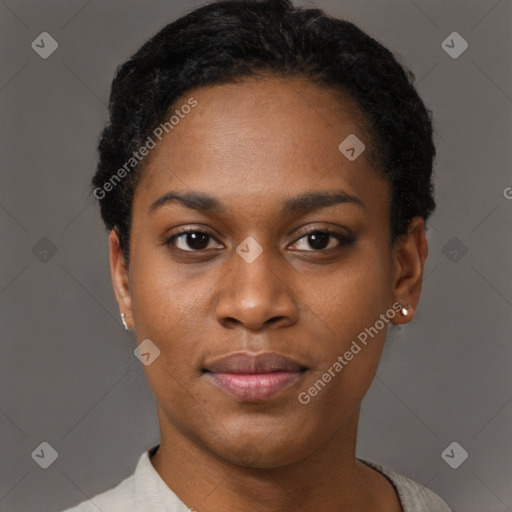 Joyful black young-adult female with short  black hair and brown eyes