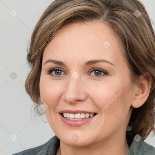 Joyful white adult female with medium  brown hair and grey eyes