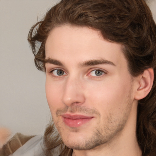 Joyful white young-adult male with medium  brown hair and brown eyes