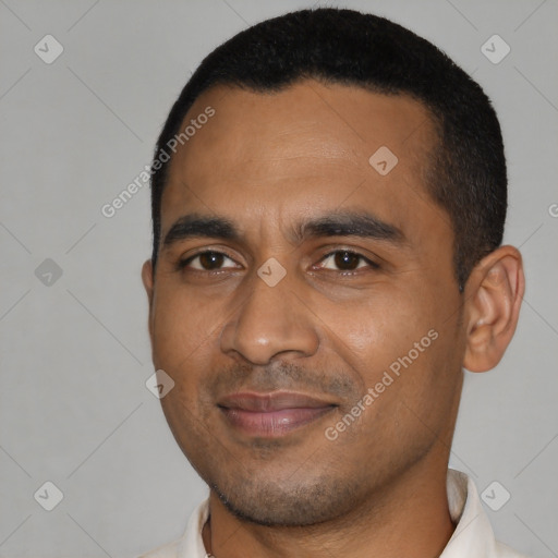 Joyful black young-adult male with short  black hair and brown eyes