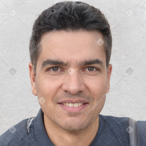 Joyful white adult male with short  brown hair and brown eyes