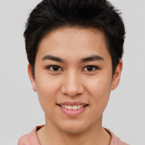 Joyful asian young-adult male with short  brown hair and brown eyes