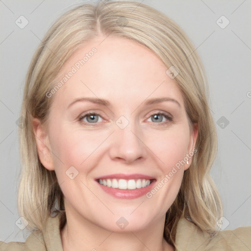 Joyful white young-adult female with medium  brown hair and blue eyes