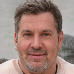 Joyful white middle-aged male with short  brown hair and brown eyes