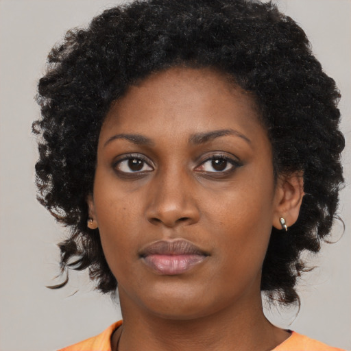 Neutral black young-adult female with medium  black hair and brown eyes