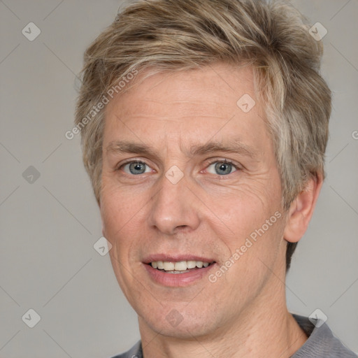 Joyful white adult male with short  brown hair and grey eyes