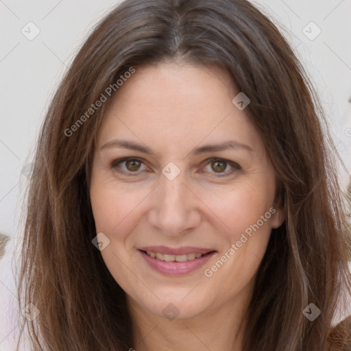 Joyful white adult female with long  brown hair and brown eyes