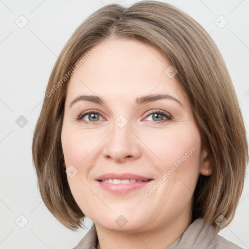 Joyful white young-adult female with medium  brown hair and green eyes