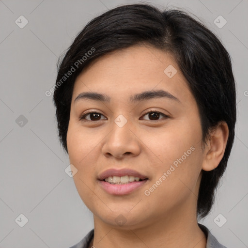 Joyful asian young-adult female with medium  black hair and brown eyes