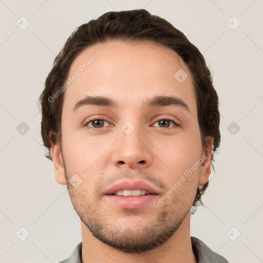 Neutral white young-adult male with short  brown hair and grey eyes