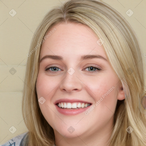 Joyful white young-adult female with long  brown hair and blue eyes