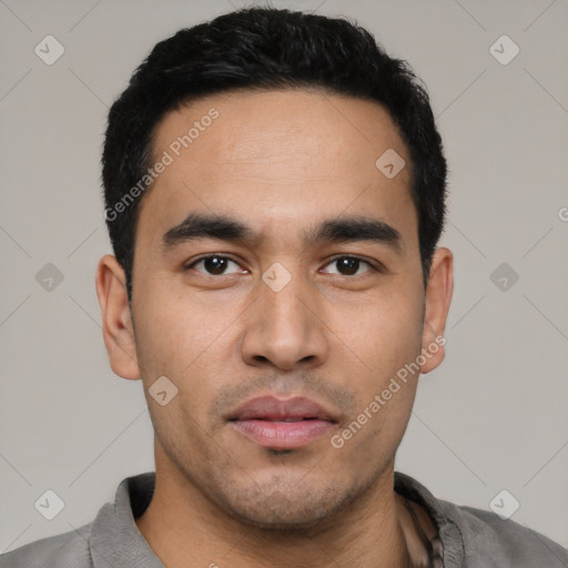 Neutral latino young-adult male with short  black hair and brown eyes