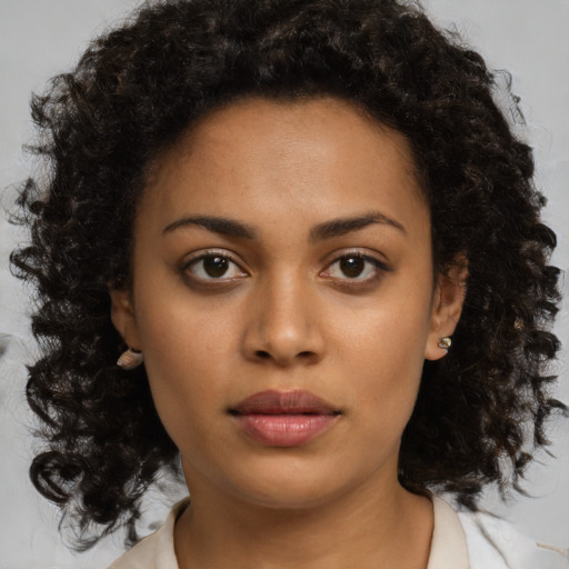 Neutral black young-adult female with medium  brown hair and brown eyes