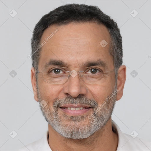 Joyful white adult male with short  black hair and brown eyes