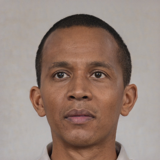 Neutral black adult male with short  black hair and brown eyes