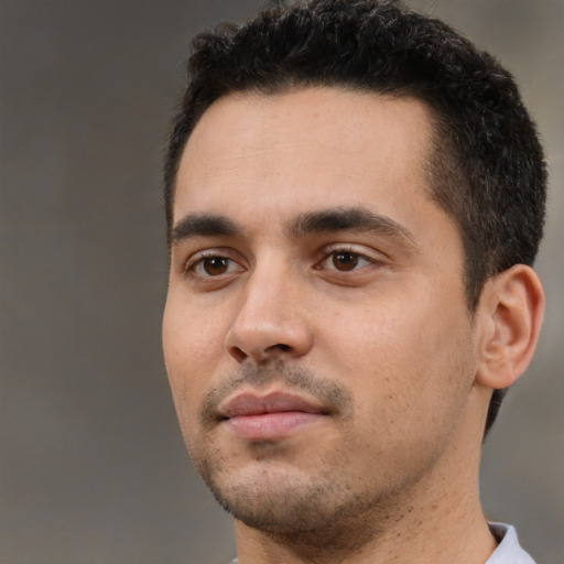 Neutral white young-adult male with short  black hair and brown eyes