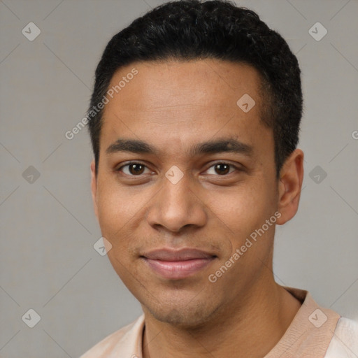 Joyful latino young-adult male with short  black hair and brown eyes