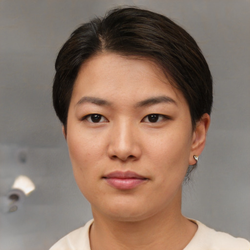 Neutral asian young-adult female with short  brown hair and brown eyes