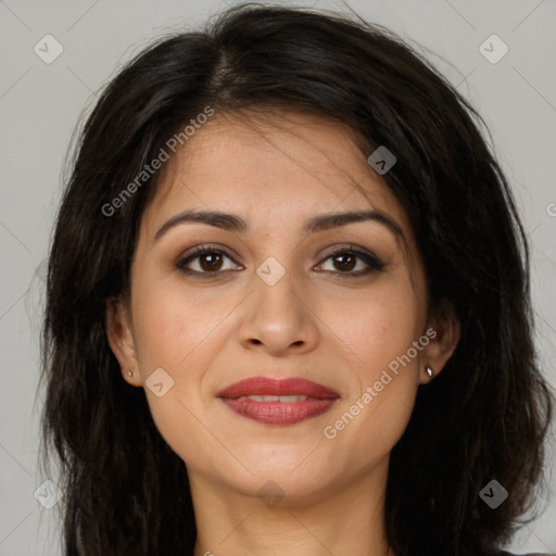 Joyful latino young-adult female with long  brown hair and brown eyes