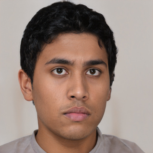 Neutral latino young-adult male with short  brown hair and brown eyes