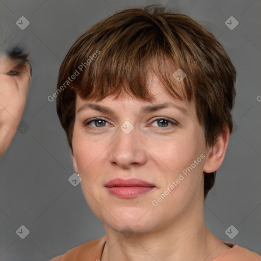 Joyful white adult female with short  brown hair and grey eyes