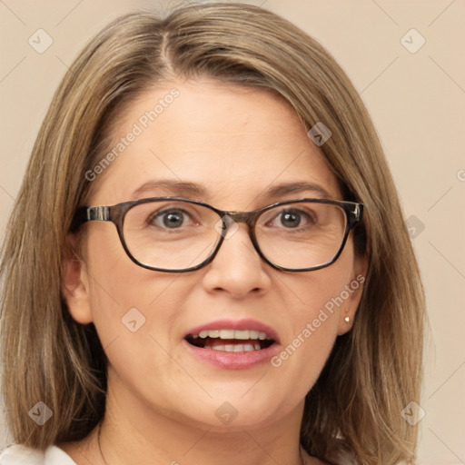 Joyful white adult female with medium  brown hair and blue eyes