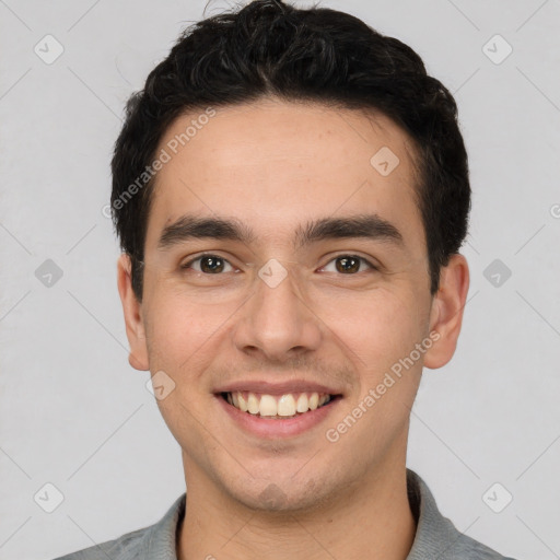 Joyful white young-adult male with short  black hair and brown eyes