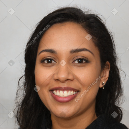 Joyful latino young-adult female with long  brown hair and brown eyes