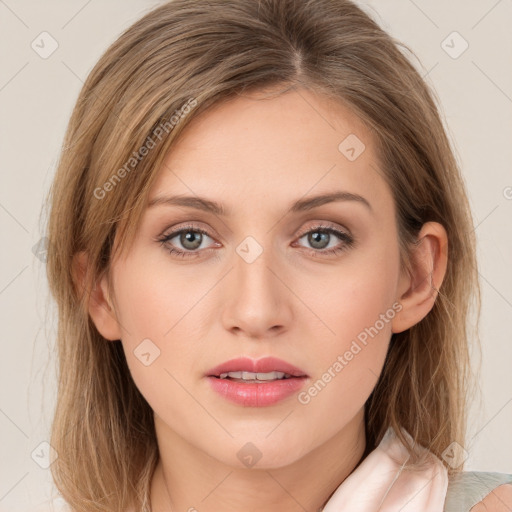 Joyful white young-adult female with medium  brown hair and green eyes