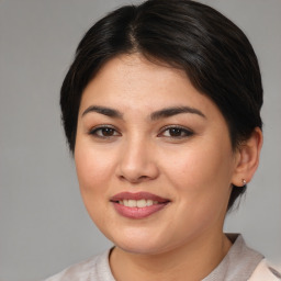 Joyful white young-adult female with medium  brown hair and brown eyes