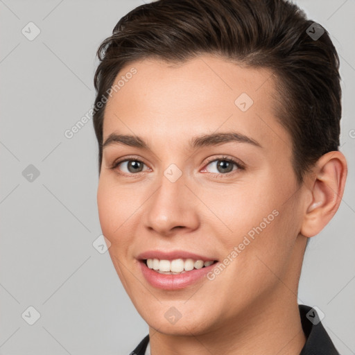 Joyful white young-adult female with short  brown hair and brown eyes