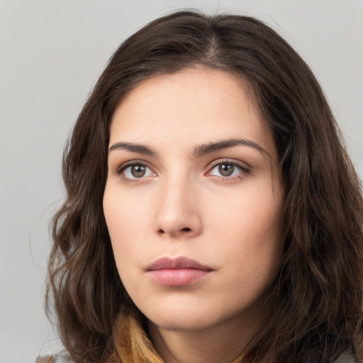 Neutral white young-adult female with long  brown hair and brown eyes