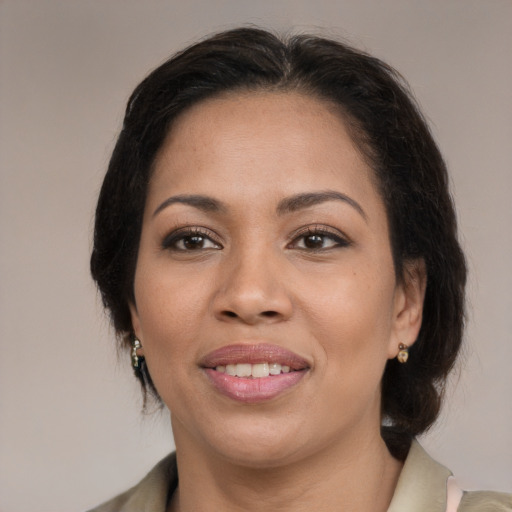 Joyful latino young-adult female with medium  brown hair and brown eyes