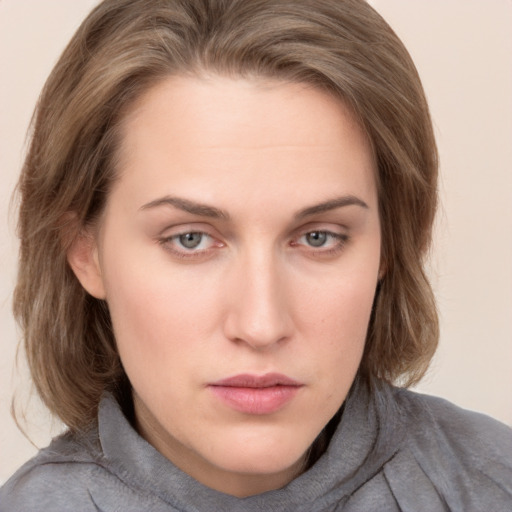 Neutral white young-adult female with medium  brown hair and grey eyes